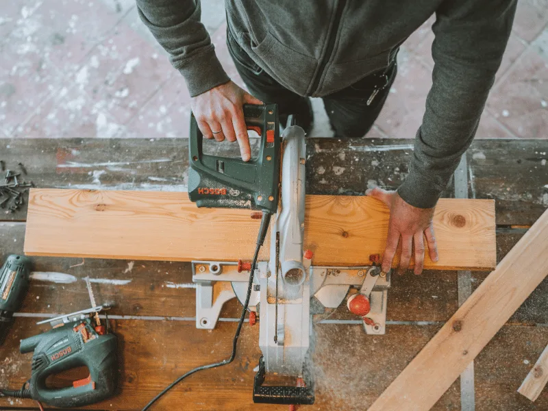 wood being cut with a saw