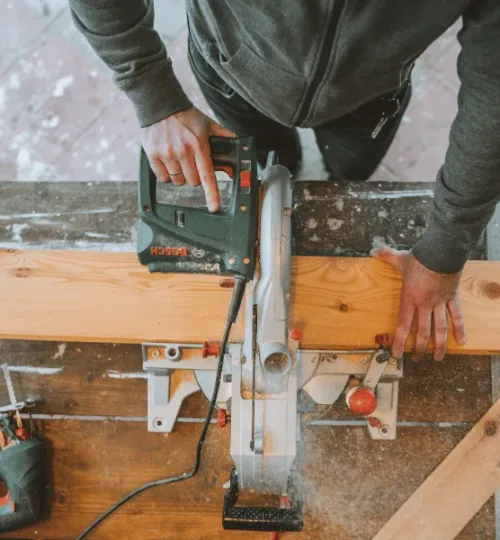 wood being cut with a saw