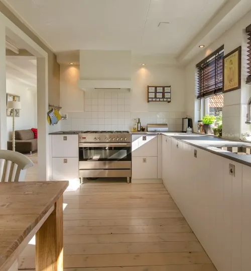 A picture of a kitchen with hardwood floors